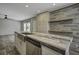 Kitchen island featuring wood countertops and a stainless steel sink at 108 Wisteria Falls Ln, Saint Stephen, SC 29479
