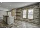 Open-concept kitchen featuring an island with wood countertops and white cabinetry at 108 Wisteria Falls Ln, Saint Stephen, SC 29479