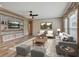 Inviting living room with modern decor, comfortable seating, and a decorative entertainment center with shelving at 108 Wisteria Falls Ln, Saint Stephen, SC 29479