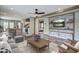 Comfortable living room featuring stylish furniture, wood accents, and an open layout connecting to the kitchen at 108 Wisteria Falls Ln, Saint Stephen, SC 29479
