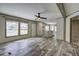 Bright living room showcasing wood-look floors and ample natural light at 108 Wisteria Falls Ln, Saint Stephen, SC 29479