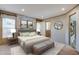 Serene bedroom featuring a plush bed, decorative wall art, and an en-suite bathroom for added convenience at 108 Wisteria Falls Ln, Saint Stephen, SC 29479