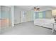 Bright and airy bedroom featuring a neutral color palette, ceiling fan and multiple closets and doorways at 110 W 2Nd South St, Summerville, SC 29483