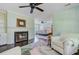 A view from the living room to the bedroom with fireplace, bed and a colorful rug at 110 W 2Nd South St, Summerville, SC 29483