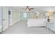 Spacious bedroom with a white bed, light blue walls, neutral carpet, ceiling fan, and ample closet space at 110 W 2Nd South St, Summerville, SC 29483