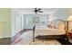 Cozy bedroom showcasing a bed, closet, and two windows for natural light at 110 W 2Nd South St, Summerville, SC 29483