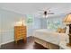 Bedroom features hardwood floors, bright windows, and an antique dresser at 110 W 2Nd South St, Summerville, SC 29483
