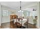 Open-concept breakfast nook and living room with lots of natural light and charming furniture at 110 W 2Nd South St, Summerville, SC 29483