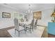 Charming dining room featuring a chandelier, elegant furnishings, and large windows that create a bright and inviting atmosphere at 110 W 2Nd South St, Summerville, SC 29483