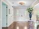 Spacious entryway showcasing hardwood floors, elegant lighting, and decorative details with views into other living areas at 110 W 2Nd South St, Summerville, SC 29483