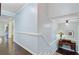 Hallway features decorative wainscoting and a desk nook with a stained glass lamp at 110 W 2Nd South St, Summerville, SC 29483
