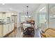 Eat-in kitchen featuring stainless steel appliances, hardwood floors, and a breakfast table at 110 W 2Nd South St, Summerville, SC 29483