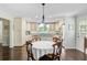 Spacious kitchen with stainless steel appliances, hardwood floors, and a breakfast table at 110 W 2Nd South St, Summerville, SC 29483
