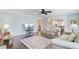 Inviting living room featuring sofas, a leather ottoman, and an open view to the kitchen at 110 W 2Nd South St, Summerville, SC 29483