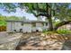 Spacious backyard featuring a brick house and a large, mature tree providing ample shade at 111 Circle Dr, Summerville, SC 29485