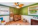 Charming Bedroom with wood floors, leafy ceiling fan, and cozy crib with hanging string lights at 111 Circle Dr, Summerville, SC 29485