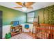 This adorable Bedroom features a cozy crib, fun decorations, and bright natural light at 111 Circle Dr, Summerville, SC 29485