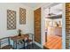 Bright dining area features an oval table, brick accent wall, and unique decorative wall hangings at 111 Circle Dr, Summerville, SC 29485