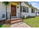 Charming front porch with brick steps, decorative railing, and a warm, welcoming entrance at 111 Circle Dr, Summerville, SC 29485