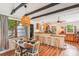Cozy eat-in kitchen with butcher block countertops, wood beams, and a bright dining area at 111 Circle Dr, Summerville, SC 29485