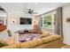 Cozy living room with hardwood floors, a ceiling fan, and a rocking chair by the window at 111 Circle Dr, Summerville, SC 29485