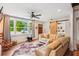 Bright living room featuring hardwood floors, a barn door, and a cozy seating area at 111 Circle Dr, Summerville, SC 29485