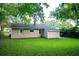 A spacious backyard featuring green lawn and a home exterior, perfect for outdoor enjoyment at 1137 Dickson Ave, Hanahan, SC 29410