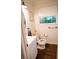 Cozy half bathroom showcasing a modern vanity, updated fixtures, and a bright window at 1137 Dickson Ave, Hanahan, SC 29410