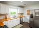 Bright kitchen with white cabinets, stainless steel appliances, and butcherblock countertops at 1137 Dickson Ave, Hanahan, SC 29410