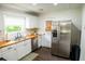 Updated kitchen with white cabinets, stainless steel appliances, and butcherblock countertops, creating a modern and efficient space at 1137 Dickson Ave, Hanahan, SC 29410