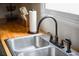 Close-up of kitchen sink with stainless steel fixtures and butcherblock countertops at 1137 Dickson Ave, Hanahan, SC 29410