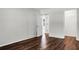 Empty bedroom with hardwood floors, open closet, and a view to another room at 114 Heritage St, Summerville, SC 29485
