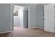Bedroom with neutral carpet, base trim and an open closet area visible through a large doorway at 114 Heritage St, Summerville, SC 29485