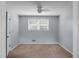 Cozy bedroom with a ceiling fan, neutral carpet, and a window overlooking the exterior at 114 Heritage St, Summerville, SC 29485