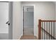 Hallway with hardwood floors, railing, and view into an adjacent bedroom at 114 Heritage St, Summerville, SC 29485