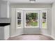 Bright kitchen nook features a bay window with views of the spacious backyard at 114 Heritage St, Summerville, SC 29485