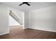 Bright living room showcasing wood floors, stairs with black balusters, and fresh paint at 114 Heritage St, Summerville, SC 29485