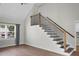 Bright living room featuring wood floors and stairs with black balusters at 114 Heritage St, Summerville, SC 29485