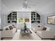 Bright living room featuring stylish decor, built-in shelving, neutral-toned furniture and a window with a view at 114 Heritage St, Summerville, SC 29485