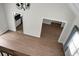 Bright living room featuring hardwood floors with doorways into kitchen and other rooms at 114 Heritage St, Summerville, SC 29485