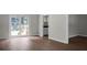Bright living room featuring hardwood floors and sliding glass doors leading to outdoor deck at 114 Heritage St, Summerville, SC 29485