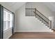 Bright living room featuring wood floors and stairs with black balusters at 114 Heritage St, Summerville, SC 29485