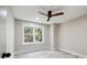 Inviting bedroom with a modern ceiling fan, bright natural light, and neutral wall color at 1161 Monaco Dr, Mount Pleasant, SC 29464