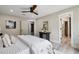 Bright bedroom featuring a ceiling fan, modern decor, and an ensuite bathroom for added convenience at 1161 Monaco Dr, Mount Pleasant, SC 29464