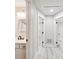 Well-lit hallway leading to a modern bathroom with stylish fixtures at 1161 Monaco Dr, Mount Pleasant, SC 29464