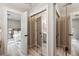 Hallway with mirror closet leading to bedroom with ceiling fan and ensuite bathroom at 1161 Monaco Dr, Mount Pleasant, SC 29464