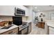 Cozy kitchen featuring stainless steel appliances, white cabinets, and a dining area at 1161 Monaco Dr, Mount Pleasant, SC 29464