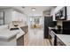 Modern kitchen with stainless steel appliances, quartz countertops, and light wood flooring at 1161 Monaco Dr, Mount Pleasant, SC 29464