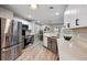 Stylish kitchen with stainless steel appliances, white cabinets, and a view of the dining area at 1161 Monaco Dr, Mount Pleasant, SC 29464