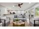 Open living area with modern furniture, backyard access, and adjacent kitchen for seamless living at 1161 Monaco Dr, Mount Pleasant, SC 29464